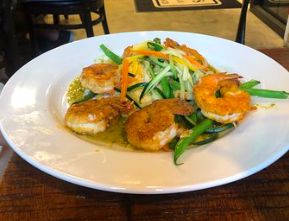 Doc Ford's Rum Bar & Grille signature dishes Shrimp and Grits
Seafood Paella
Key Lime Pie